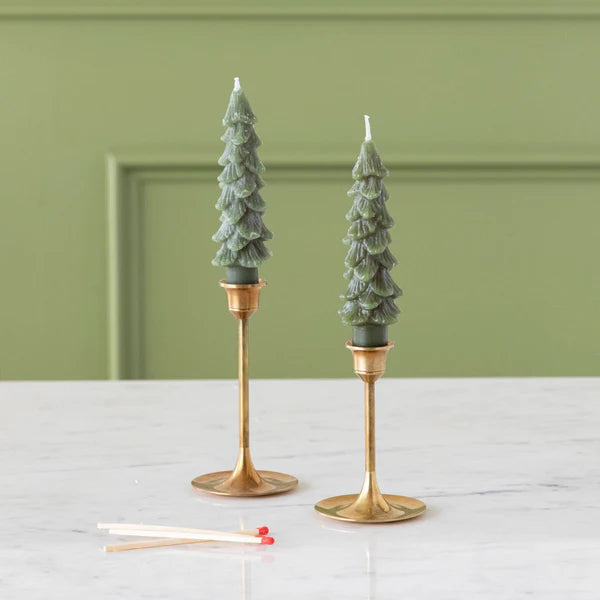 Flamless Taper Candles styled in elegant holders on a marble surface, perfect for festive decor.